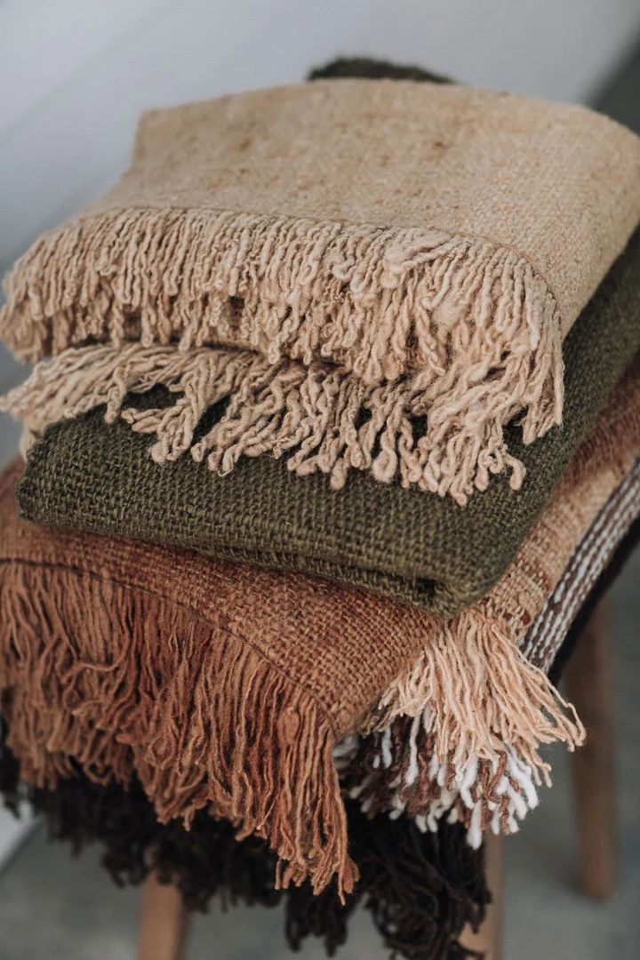 Layered home textiles arranged for relaxed everyday living